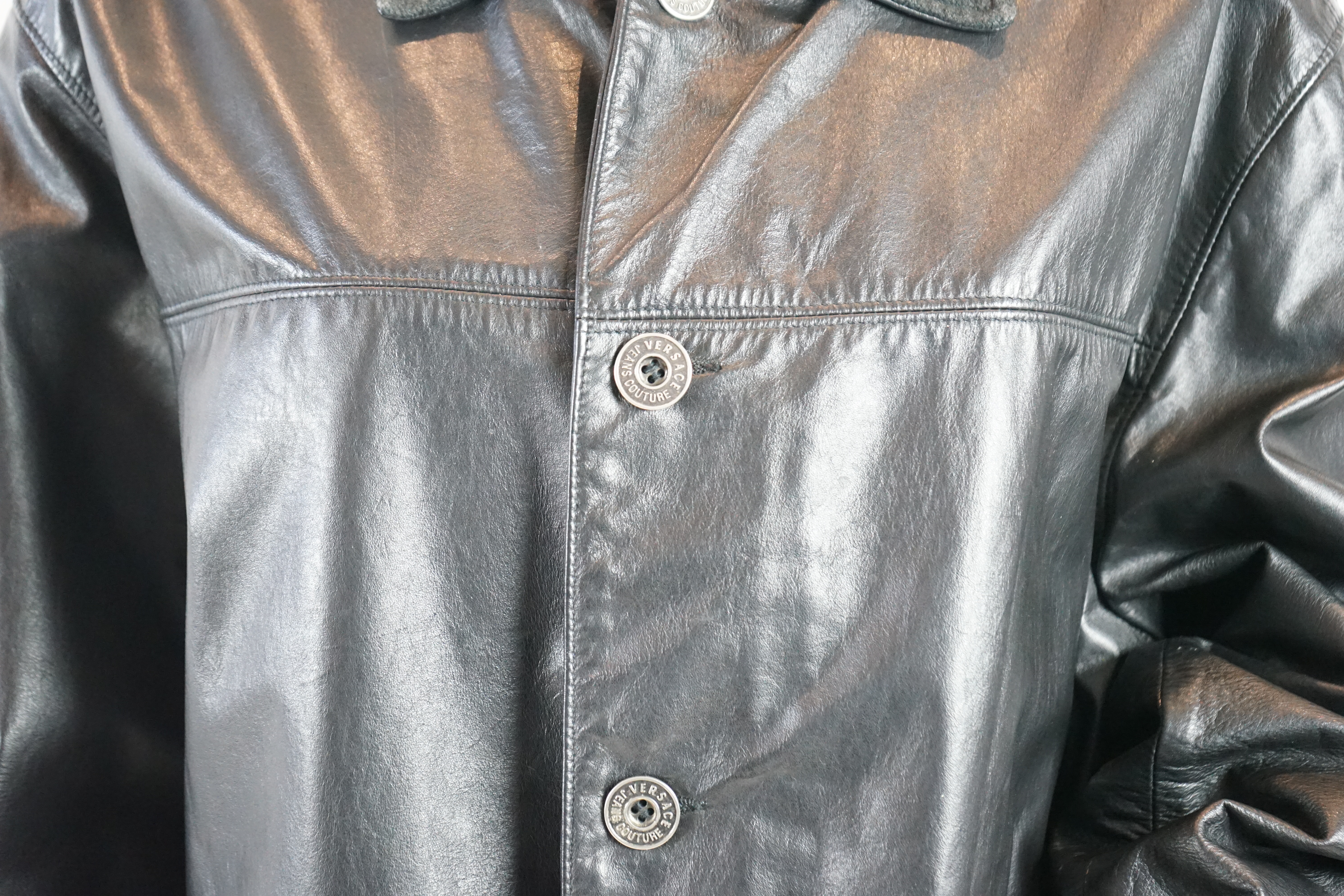 A Versace Jeans Couture men's black leather jacket and a Donna Karan men's black leather jacket, Size L